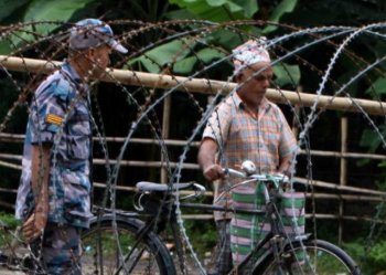 Nepalese police guard the entrance to The Beldangi II Refugee Camp some south-east of Kathmandu. (Prakash Mathema/AFP/Getty Images)
