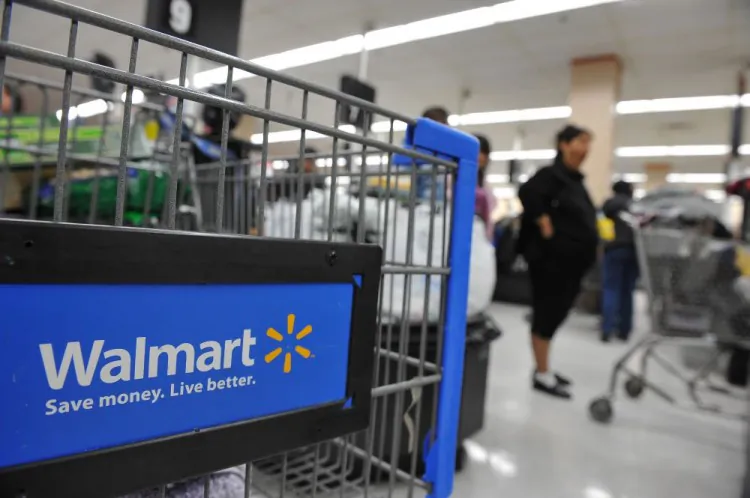 Shoppers wait in line to pay for their purchases at a Walmart store in Los Angeles. (Robyn Beck/AFP/Getty Images)