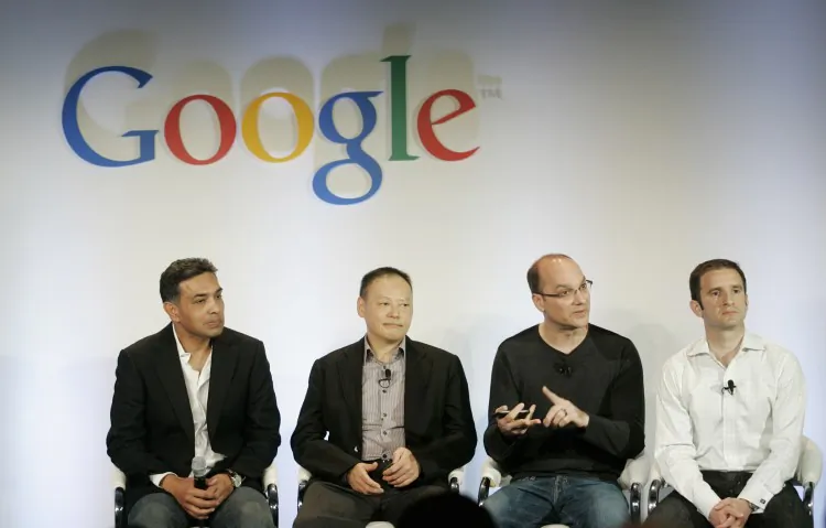 (L-R) In this file photo, Dr. Sanjay Jha, CEO of Motorola, Peter Chou, CEO of HTC, Andy Rubin, vice president of engineering for Google, and Mario Quieroz, vice president of product management for Google, sit onstage at Google headquarters Jan. 5, 2010. Google said Saturday that Chinese authorities have approved its purchase of Motorola. (Robert Galbraith-Pool/Getty Images)
