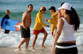 Sydney's Bondi Beach surf rescue personnel (yellow-C) advise swimmers to leave the beach after it was declared closed due to a tsunami threat on February 28. (Greg Wood/AFP/Getty Images) Sydney's Bondi Beach surf rescue personnel (yellow-C) advise swimmers to leave the beach after it was declared closed due to a tsunami threat on February 28. (Greg Wood/AFP/Getty Images)