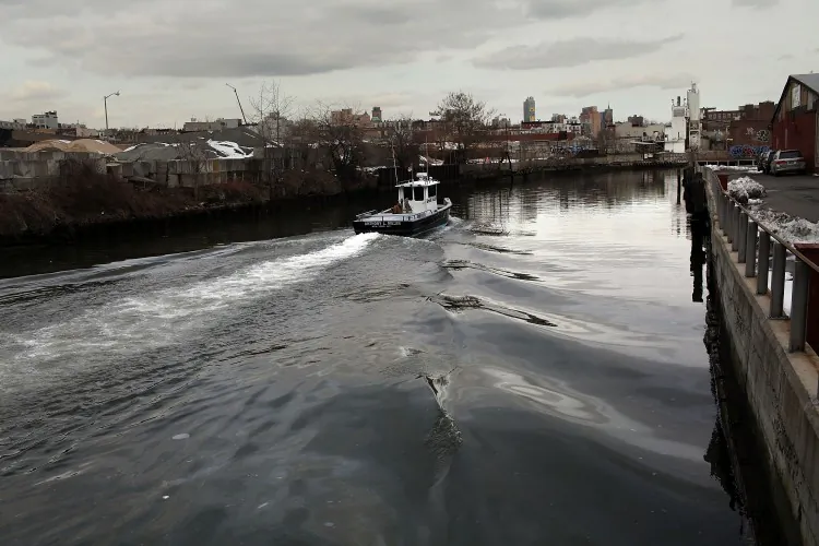A boat navigates down the polluted Gowanus Canal on March 2, 2010 in the Brooklyn borough of New York. (Spencer Platt/Getty Images)