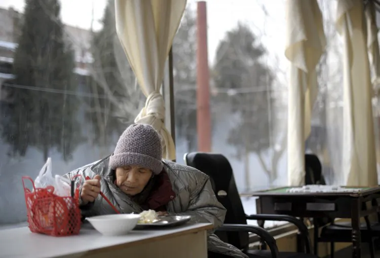 In a picture taken on Jan. 8, 2010 an elderly woman eats her lunch at a nursing house in Beijing. Expert estimates that more than 10 million only-children could die before the age of 25, leaving 20 million bereaved parents by their middle-age in China. (Liu Jin/AFP/Getty Images)