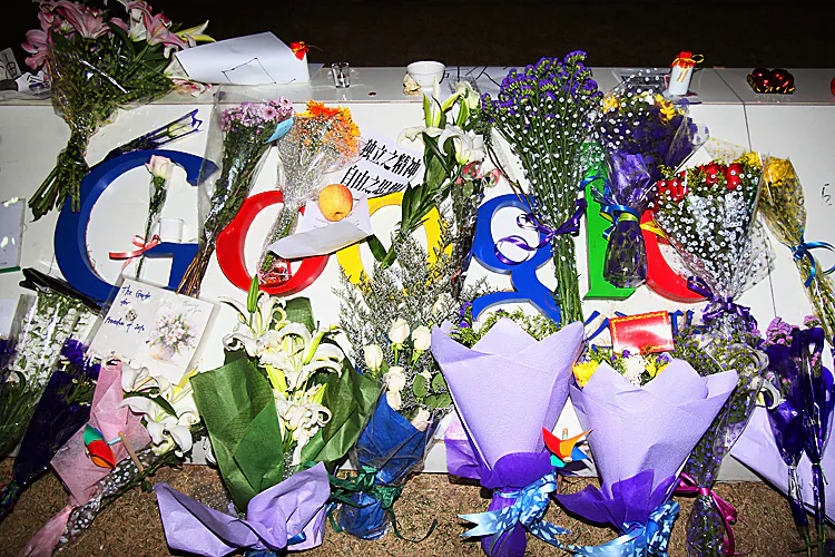 A card, a letter and flowers are placed on the Google logo at its China headquarters building in Beijing, China, on March 23, 2010, the day Google announced its intention to close its Chinese-language search engine in mainland China. A new report documents how Zhou Yongkang and Bo Xilai conspired with the Chinese search engine Baidu to use the Internet to attack their opponents. The price Zhou and Bo were willing to pay: Get Google out of China. (Feng Li/Getty Images)