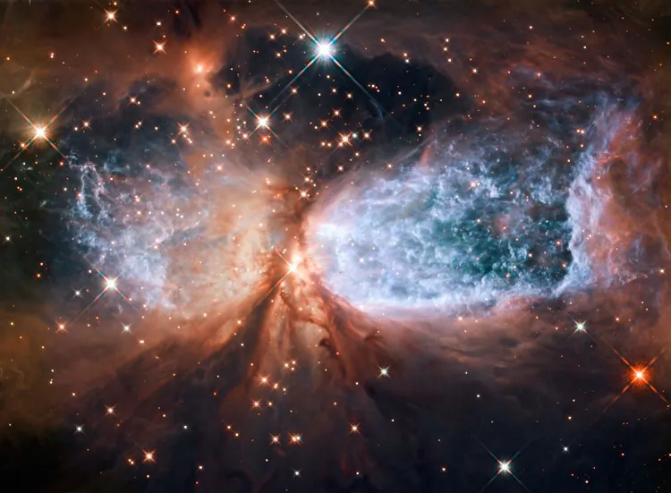 This image shows a ground-based telescope image of the region around star forming region Sh 2-106. (NASA, ESA, Digitized Sky Survey 2 (Acknowledgement: Davide De Martin))