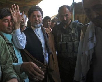Afghan parliamentary candidate Mohammad Mohaqiq waves at an election campaign event with Shia Muslim Hazara Afghans in Kabul on September 13, 2010. (Massoud Hossaini/AFP/Getty Images)