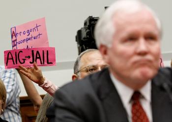 AIG: Former AIG CEO Edward Liddy testifies before the U.S. House Financial Services Committee in March 2009 as protesters decry the federal government's bailout of the troubled insurer. (Chip Somodevilla/Getty Images) AIG: Former AIG CEO Edward Liddy testifies before the U.S. House Financial Services Committee in March 2009 as protesters decry the federal government's bailout of the troubled insurer. (Chip Somodevilla/Getty Images)