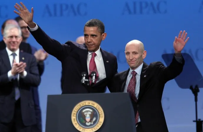 President Barack Obama waves with Lee Rosenberg, president of the American Israel Public Affairs Committee (AIPAC) after speaking at their annual conference in Washington, D.C., March 4. Obama reaffirmed his strong backing for key ally Israel, warning Iran that he would not hesitate to use force, if required, to stop it developing a nuclear weapon. (CHRIS KLEPONIS/AFP/Getty Images)