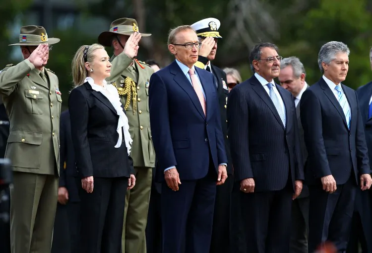 (Front L-R) U.S. Secretary of State Hillary Clinton, Australian Minister for Foreign Affairs Bob Carr, U.S. Secretary of Defense Leon Panetta, and Australian Minister for Defense Stephen Smith stand to attention during a wreath laying ceremony at Kings Park on Nov. 14 in Perth, Australia. (Paul Kane/Getty Images)