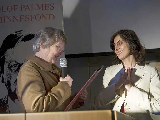 Shirin Ardalan (R), sister of Iranian Parvin Ardalan, receives the Olof Palme Prize from Lisbeth Palme (L) on her sister's behalf in Stockholm on March 6, 2008. Parvin Ardalan was awarded the 2007 prize for her work on gender equality and democracy in Iran, but was prevented by authorities from leaving Iran to collect the prize. (Henrik Montgomery/AFP/Getty Images)