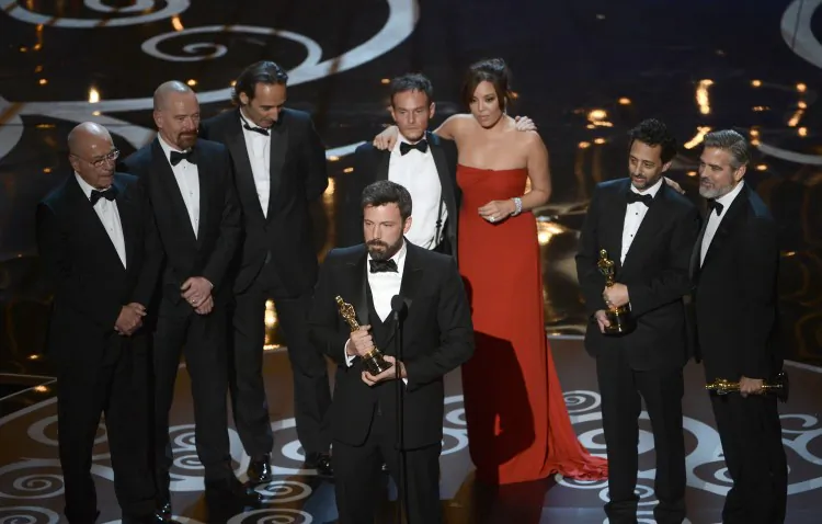 Actor/producer/director Ben Affleck accepts the best picture award for ”Argo” onstage along with members of the cast and crew during the Oscars held at the Dolby Theatre on Feb. 24, 2013 in Hollywood, California. Making a Hollywood production about a true event that had much impact on U.S.-Iran relations while remaining accurate was a challenge for filmmakers. (Kevin Winter/Getty Images)