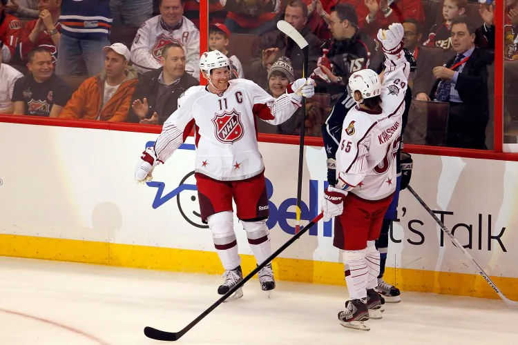 NHL All-Star Game: Daniel Alfredsson celebrates his second goal with Erik Karlsson. (Gregory Shamus/Getty Images)