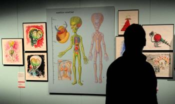 A Visitor looks at the Anatomy of a Martian at a major exhibition, presented as part of Melbourne Winter Masterpieces 2010, which explores the full career of artist and film maker Tim Burton, as a director, concept artist illustrator and photographer. (WILLIAM WEST/AFP/Getty Images)