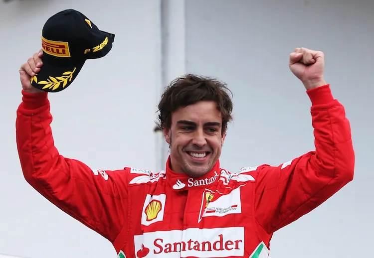 Fernando Alonso of Spain and Ferrari celebrates on the podium after winning the Formula One German Grand Prix at Hockenheimring on July 22, 2012 in Hockenheim, Germany. (Mark Thompson/Getty Images)