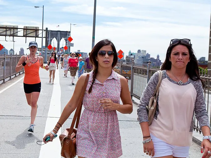 (L-R) Pedestrian Advocacy Manager Jennifer Godzeno, Executive Director of Transportation Alternatives Paul Steely White, Council member Brad Lander, Council member Stephen Levin, Council member Margaret Chin in front of the Brooklyn Bridge, New York Tuesday. (Amal Chen/The Epoch Times)