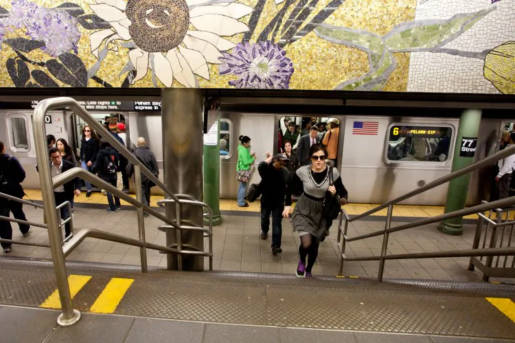 Subway riders exit the 6 train at the 77 Street station on the Upper East Side, New York, in this file photo.