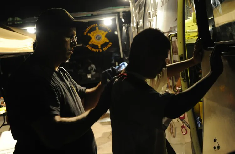 An illegal immigrant is processed by sheriff’s deputies working for Maricopa County Sheriff Joe Arpaio, after an operational sweep in Phoenix in July 2010. The Maricopa County Sheriff’s Office (MCSO) has denied accusations by the Justice Department that it “engaged in a pattern or practice of violating the Constitution and laws of the United States.” (Mark Ralston/AFP/Getty Images)