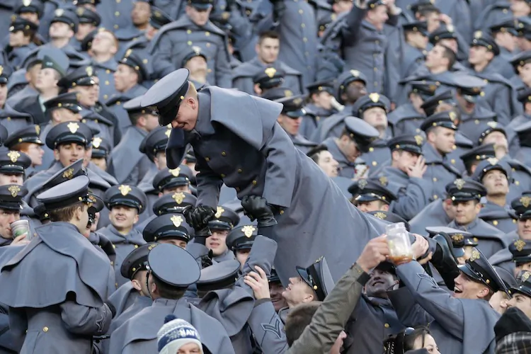 Army Cadets celebrate a first-half touchdown against the Navy Midshipmen by doing pushups in the stands of FedEx Field on Dec. 10 in Landover, MD. (Rob Carr/Getty Images)