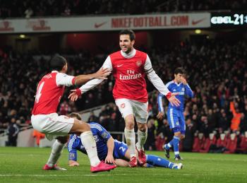 Cesc Fabregas (right) and Theo Walcott celebrate Arsenal's second of three goals against Chelsea on Monday. (Shaun Botterill/Getty Images) Cesc Fabregas (right) and Theo Walcott celebrate Arsenal's second of three goals against Chelsea on Monday. (Shaun Botterill/Getty Images)