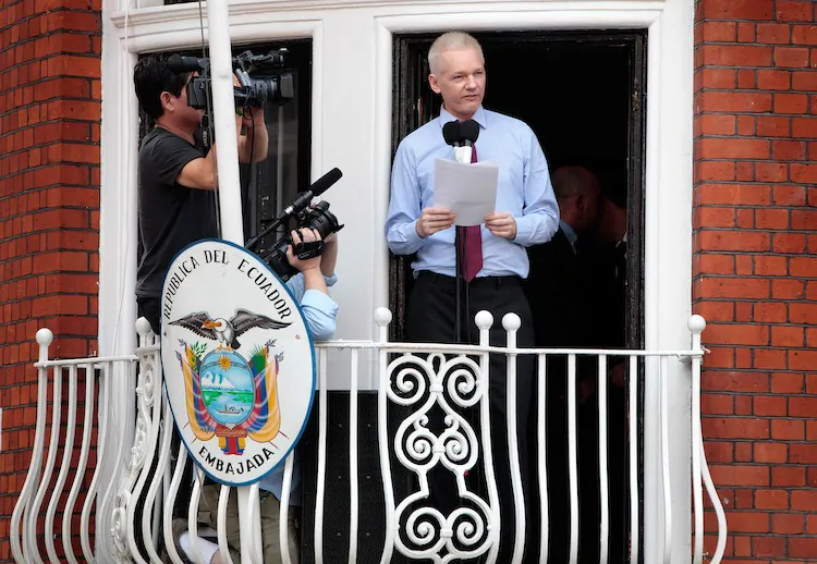 WikiLeaks founder Julian Assange speaks from the balcony of the Ecuador Embassy on Aug. 19, in London, England. (Rosie Hallam/Getty Images)