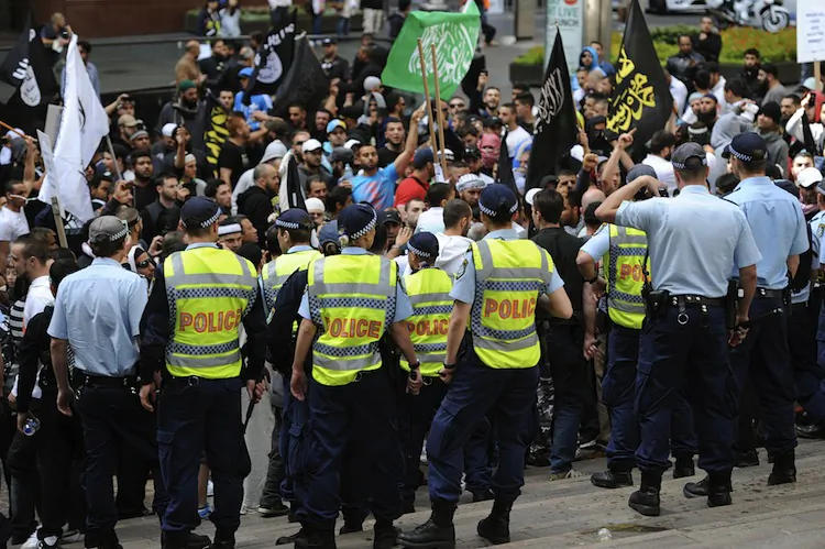 Police stand guard near the U.S. Consulate General in central Sydney on Sept. 15, as a wave of unrest against a film that mocks Islam spread to Australia. (Greg Wood/AFP/GettyImages)