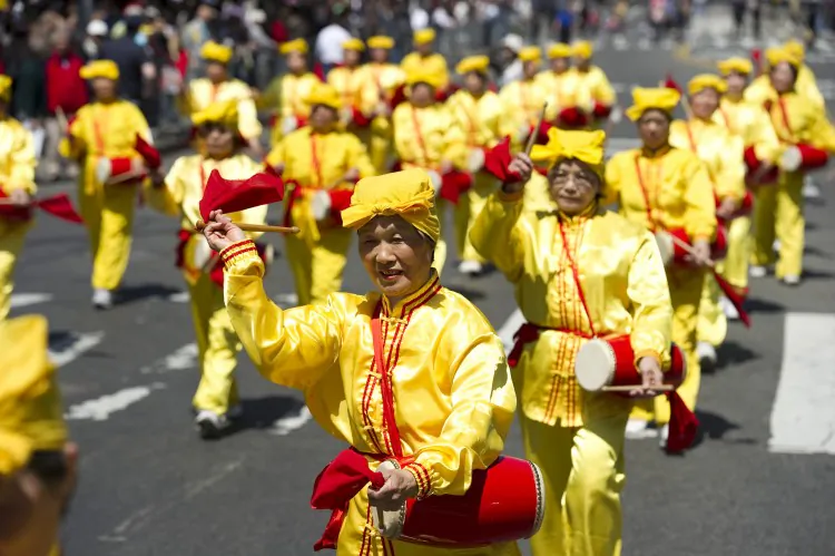 A group of drummers in a Falun Dafa parade in Chinatown, April 2010. The drummers and the Falun Dafa Association are excluded from the Chinese New Year Parade in Chinatown on Sunday, Jan. 29. Organizers cite security concerns as the reason, but others say it's a decision influenced by the Chinese Consulate. (Dai Bing/The Epoch Times)