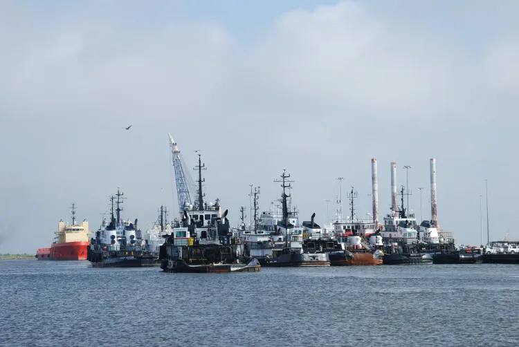 Ships which have been docked for months after a moratorium on deepwater drilling was imposed in the wake of the BP oil spill are seen in Port Fourchon, Louisiana on April 8, 2011. BP's trial on charges of gross negligence has now begun in New Orleans. (Mira Oberman/AFP/Getty Images)