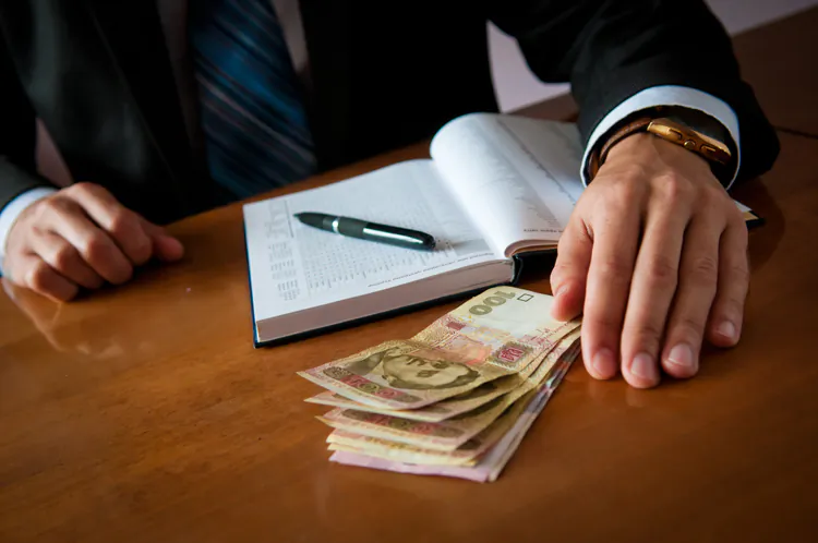 In Ukraine, about 6 million workers are paid backdoor salaries—a loss to the state in unpaid taxes of an estimated $11 billion to $12 billion annually. (Vladimir Borodin/The Epoch Times)