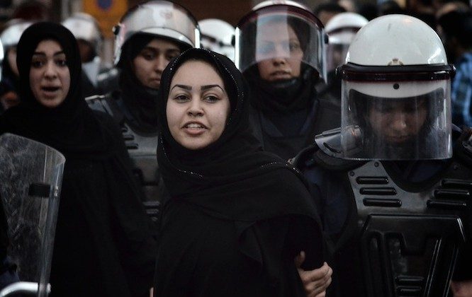 A Bahraini Shiite protester is detained by riot police during an anti-government demonstration in the center of the capital Manama on Sept. 21. (Mohammed al-Shaikh/AFP/GettyImages)