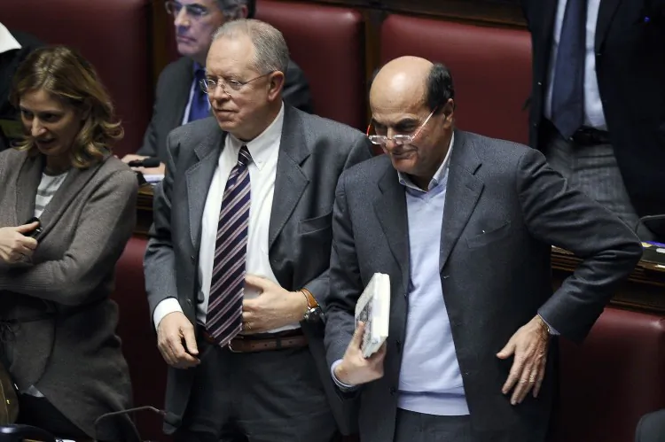 The leader of the Democratic Party Pier Luigi Bersani (R) after an address by Italian Prime Minister Silvio Berlusconi (not pictured) to the Parliament during a session on Dec. 13, 2010, in Rome. Bersani is likely to win the Italian election on Feb. 24–25, 2013, and may bring leftist principles to the office. (FILIPPO MONTEFORTE/AFP/Getty Images)