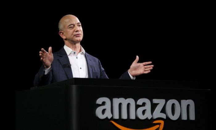 Amazon has said it will hire 50,000 additional workers to help meet customer orders during the holiday season. Above Amazon CEO Jeff Bezos unveils new Kindle reading devices at a press conference on Sept. 6, in Santa Monica, Calif. (David McNew/Getty Images)