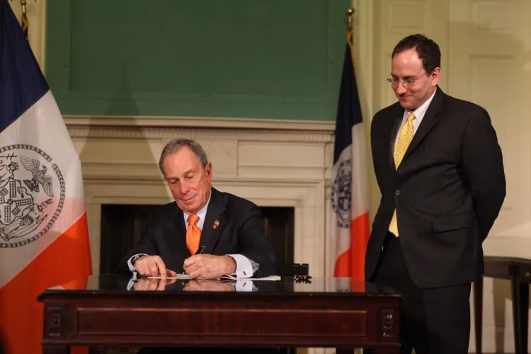 Mayor Michael Bloomberg signs four bills into law on Thursday. (Courtesy of the mayor’s office)