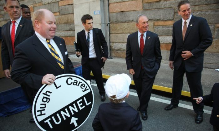 Lt. Gov. Robert J. Duffy (L), former New York Gov. David Paterson (C), and Mayor Michael Bloomberg (R) speak at the ceremony to rename the Brooklyn-Battery Tunnel in honor of former Gov. Hugh L. Carey on Oct. 22. (Courtesy of Edward Reed)
