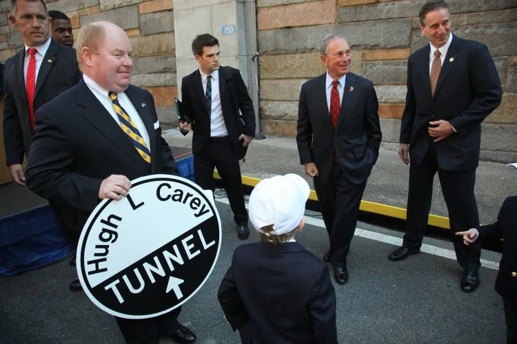 Lt. Gov. Robert J. Duffy (L), former New York Gov. David Paterson (C), and Mayor Michael Bloomberg (R) speak at the ceremony to rename the Brooklyn-Battery Tunnel in honor of former Gov. Hugh L. Carey on Oct. 22. (Courtesy of Edward Reed)