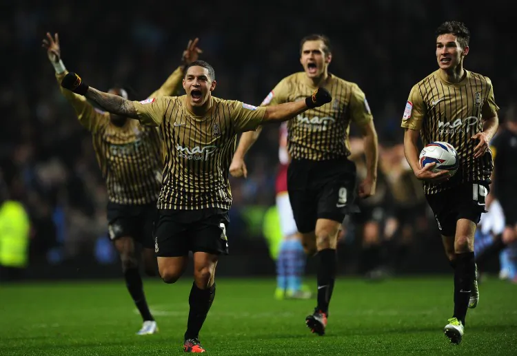 Bradford City’s Nathan Doyle and his teammates celebrate after reaching the final of the Capital One Cup at Villa Park in Birmingham, England on Tuesday, Jan. 22, 2013. (Laurence Griffiths/Getty Images)