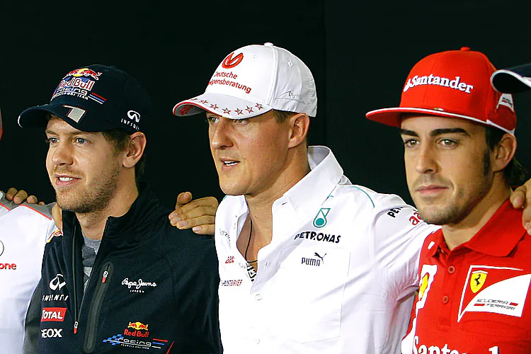 (L-R) Sebastien Vettel, Michael Schumacher and Fernando Alonso pose after a press conference at the Interlagos circuit in Sao Paulo, Brazil. November 22, 2012. Vettel and Alonso will be fighting for the championship while Schumacher will be saying his final farewells to Formula One Sunday. (Orlando Kissner/AFP/Getty Images)