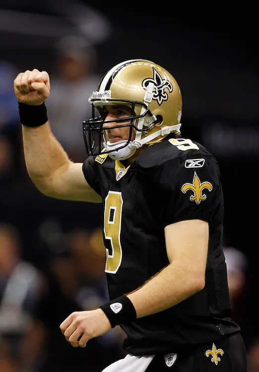 Drew Brees set a single-season record last year with 5,476 passing yards. (Chris Graythen/Getty Images)