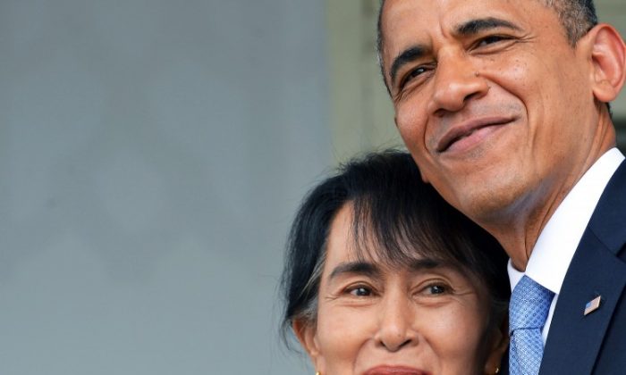 U.S. President Barack Obama hugs Burmese democracy icon and opposition leader Aung San Suu Kyi (L) as they leave after making a speech at her residence in Yangon, Burma, on Nov. 19, 2012. Obama's historic visit to Yangon aimed to encourage political reforms. (Jewel Samad/AFP/Getty Images)