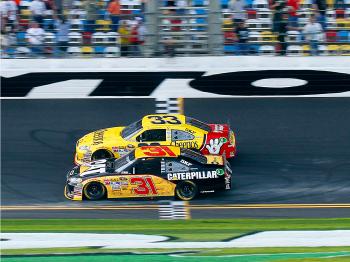 Jeff Burton in the #31 Caterpillar Chevrolet edges Clint Bowyer in the #33 Cheerios Chevrolet by .005 seconds to win the second NASCAR Sprint Cup Series Gatorade Duel at Daytona. (Jason Smith/Getty Images for NASCAR) Jeff Burton in the #31 Caterpillar Chevrolet edges Clint Bowyer in the #33 Cheerios Chevrolet by .005 seconds to win the second NASCAR Sprint Cup Series Gatorade Duel at Daytona. (Jason Smith/Getty Images for NASCAR)