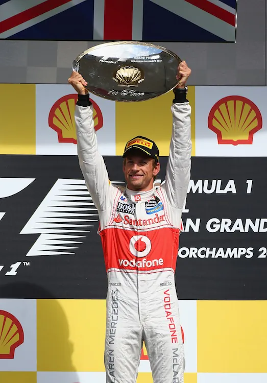 Jenson Button of McLaren celebrates on the podium after winning the Belgian Grand Prix at the Circuit of Spa Francorchamps. (Clive Mason/Getty Images)