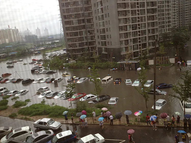 Flooding leaves many vehicles submerged in water in a residential community in Beijing on July 21. (The Epoch Times Photo Archive)