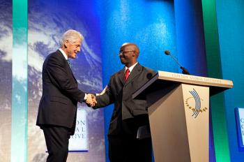 Ashifi Gogo, who was awarded a grant by the Clinton Global Initiative University, shakes hands with renowned philanthropist President Bill Clinton. He spoke on Sept. 23, updating on his company Sproxil's progress. (National Collegiate Inventors and Innovators Alliance)