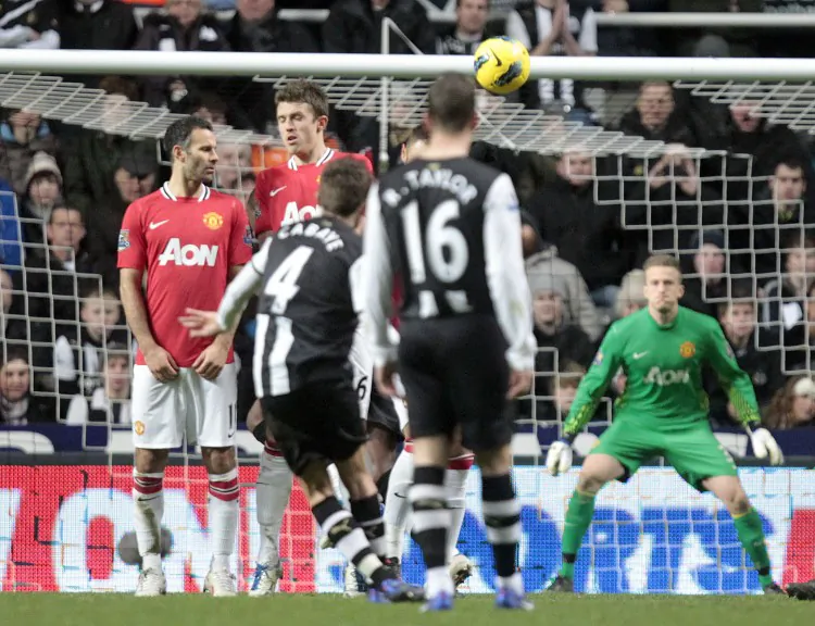 Newcastle United’s Demba Ba takes on Manchester United’s Phil Jones in Wednesday’s English Premier League action. (Stu Forster/Getty Images)