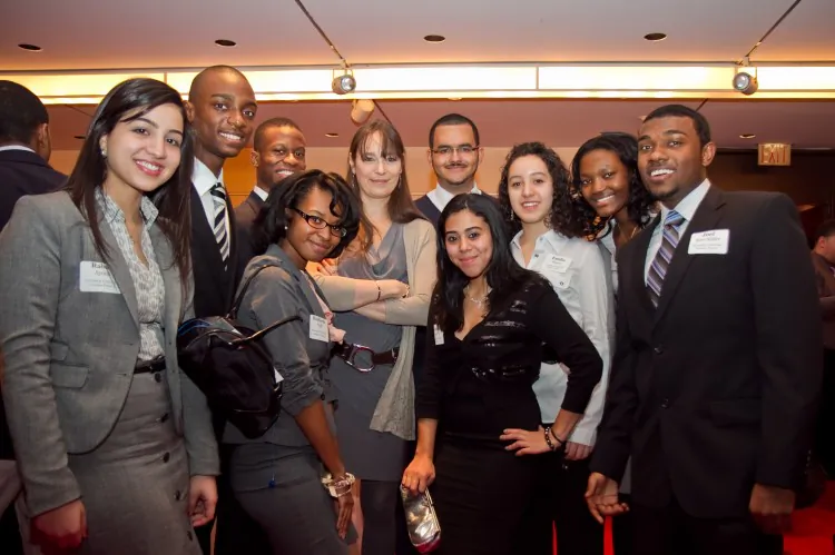 The Brandeis University Science Posse 5, with Deborah Bial, (c) founder and president of the Posse Foundation New York, during the reception before the awards ceremony on Jan 5. (Benjamin Chasteen/The Epoch Times)