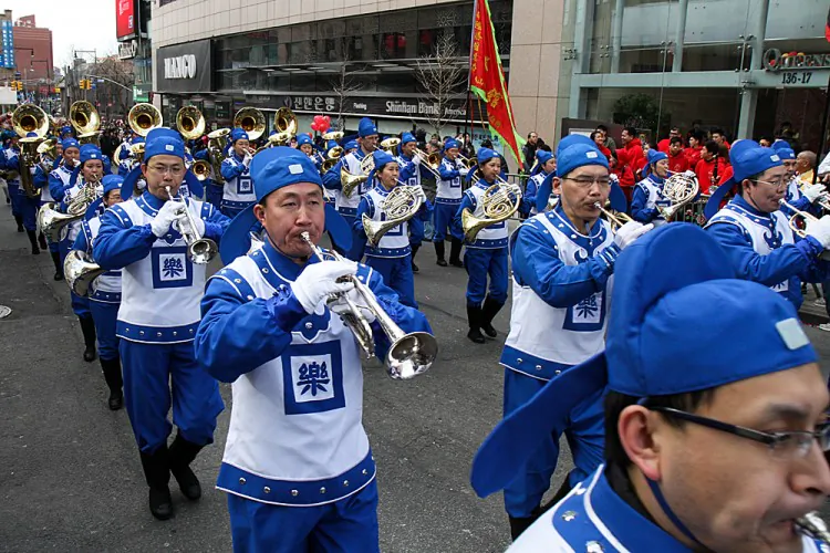 The Divine Land Marching Band participates in the 2012 Chinese New Year parade in Flushing, New York, on Saturday. (Ben Chasteen/The Epoch Times)