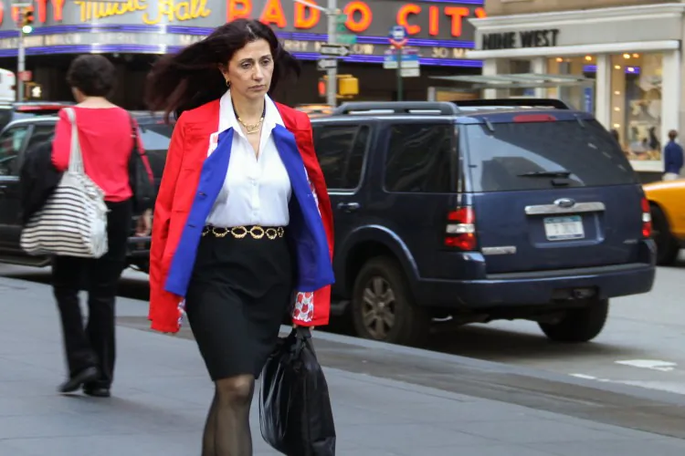 A woman walks past the Radio City Theater in Midtown Manhattan on March 20. Although women made great strides in the business world during the last century, there is still inequality in the market that stops women from achieving equal parity with men. (Benjamin Chasteen/The Epoch Times)