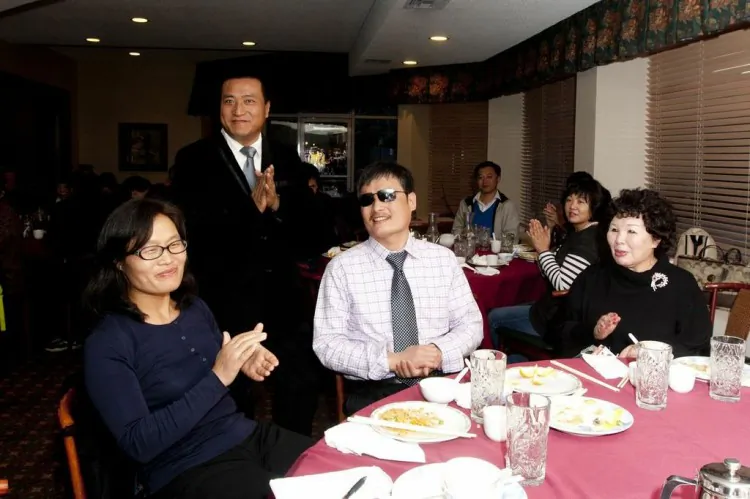 Chen Guangcheng (center) enjoyed a meal with members of the local Chinese community at a restaurant in Novato, California, on March 16. After receiving an award for his work, he highlighted what he called the gangster-like nature of the Chinese Communist Party. (Alex Ma/The Epoch Times)
