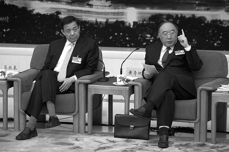 Bo Xilai (left) and Chongqing Mayor Huang Qifan (right) attending a meeting during the annual National People's Congress on March 6, 2011 in Beijing. Bo was removed from his post as Chongqing's Party chief on March 15, 2012. (Feng Li/Getty Images)