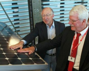 U.S. Secretary of the Interior Ken Salazar (L) and U.S. Rep. George Miller touch a solar panel as they tour Sunpower Corporation's research and development facility Oct. 14 in Richmond, California. (Justin Sullivan/Getty Images)