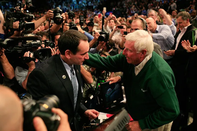 Coach Krzyzewski is greeted by Bob Knight after earning victory 903 at Madison Square Garden on Tuesday night. (Patrick McDermott/Getty Images)