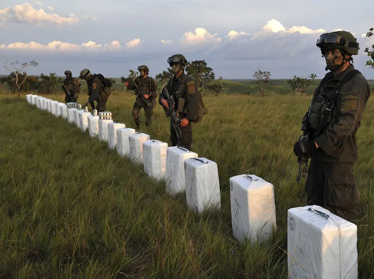 Colombian anti-narcotics police seize packages containing some 5 tons of cocaine from an illegal laboratory October 13, 2011. (Guillerm Legaria/AFP/Getty Images)